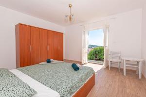 Posteľ alebo postele v izbe v ubytovaní Apartment Nocturno