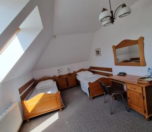 Postel nebo postele na pokoji v ubytování Hotel Karkonosze