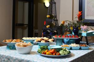 a table with many plates of food on it at Holiday Inn Express Hotel & Suites - Atlanta/Emory University Area, an IHG Hotel in Decatur