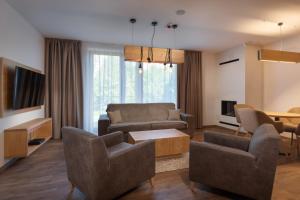 TV a/nebo společenská místnost v ubytování NIPUR sk-Apartmán Hotel Ovruč, Štrbské Pleso + 7 fotografií