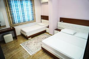 Voodi või voodid majutusasutuse Hotel Magic toas