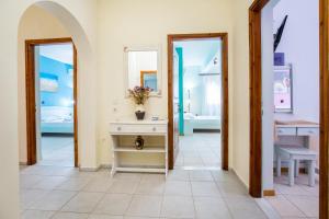a bathroom with a sink and a mirror at Malandris Studios in Skala Marion