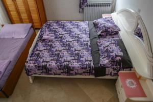 Postel nebo postele na pokoji v ubytování Apartmani Ivana