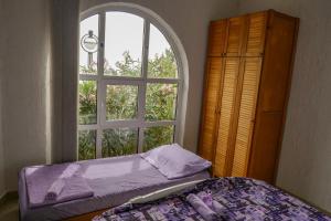 Postel nebo postele na pokoji v ubytování Apartmani Ivana