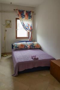 Postel nebo postele na pokoji v ubytování Apartmani Ivana