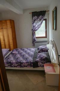 Postel nebo postele na pokoji v ubytování Apartmani Ivana