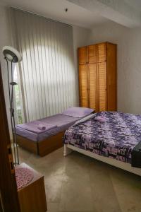 Postel nebo postele na pokoji v ubytování Apartmani Ivana
