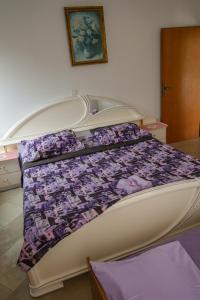 Postel nebo postele na pokoji v ubytování Apartmani Ivana