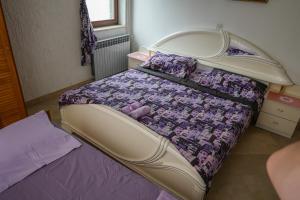 Postel nebo postele na pokoji v ubytování Apartmani Ivana
