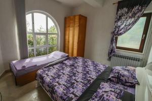 Postel nebo postele na pokoji v ubytování Apartmani Ivana