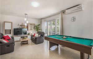 a living room with a pool table in it at Cozy Home In Kras With Kitchen in Kras