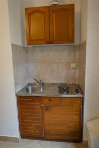 Kuchyň nebo kuchyňský kout v ubytování Apartmani Ivana