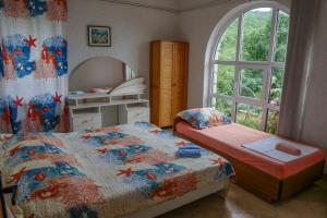 Postel nebo postele na pokoji v ubytování Apartmani Ivana