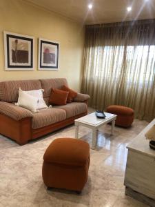 a living room with a couch and a table at FIFA in Arzúa