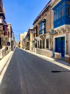 an empty street in the middle of a city at Sliema 248 Boutique Studios in Sliema