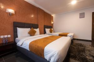 Postel nebo postele na pokoji v ubytování Airport View Hotel