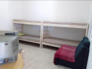 Ένα ή περισσότερα κρεβάτια σε δωμάτιο στο Casa de praia em Ilha Comprida +1 φωτογραφίες