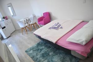 Postel nebo postele na pokoji v ubytování Apartman Maja