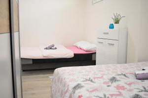 Postel nebo postele na pokoji v ubytování Apartman Maja