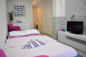 Postel nebo postele na pokoji v ubytování Apartman Maja