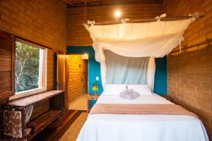 Cama ou camas em um quarto em Lilás Hospedagem e Terapias