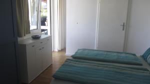 Posteľ alebo postele v izbe v ubytovaní Appartement am Strand