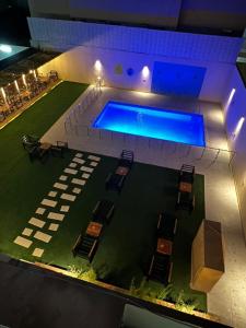 an overhead view of a swimming pool in a building at Doolv Hotel in Hail