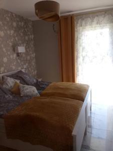 ブワディスワボボにあるRelaxのベッドルーム1室(窓付)