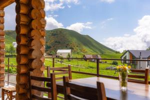a table with a view of a mountain at Snow Time Eco Chalet in Gudauri