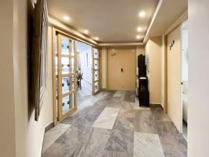 a hallway of a house with a tile floor at Air Lux in Mexico City