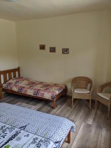 Postel nebo postele na pokoji v ubytování Tulipan Haz