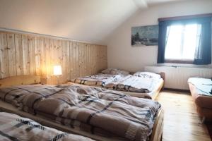 Postel nebo postele na pokoji v ubytování Berghof - horská chata