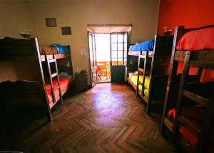 a room with a bunch of bunk beds at Colors House in Sucre