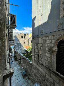 a view of an alley between two buildings at Apartment Zakrjan in Old town Korčula in Korčula