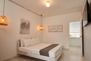 Postel nebo postele na pokoji v ubytování Kpré Coveñas by Bernalo Hotels