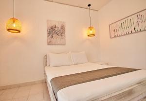 Postel nebo postele na pokoji v ubytování Kpré Coveñas by Bernalo Hotels