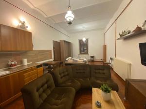 a living room with a couch and a table at ROBHOUSE in Fabriano