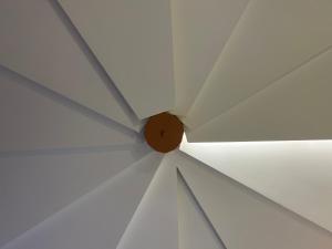 a close up of a ceiling with a wooden circle at Sinestesia in Polignano a Mare