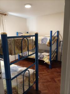 a group of bunk beds in a room at Hermoso departamento en Mendoza in Mendoza