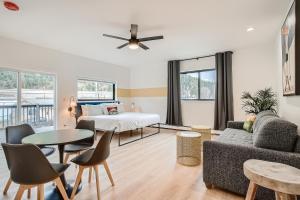 a living room with a bed and a couch and a table at Uplift Inn in Idaho Springs