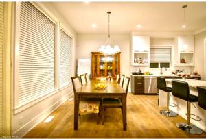 a dining room with a table and chairs in a kitchen at Good location in Surrey