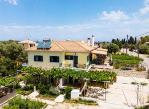 a house in a vineyard with a roof at Dionysia Rooms in Lefkada