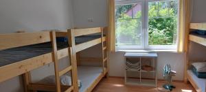 Posteľ alebo postele v izbe v ubytovaní Hostel Zamárdi