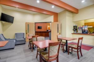a waiting room at a hospital with tables and chairs at Americas Best Value Inn & Suites Independence VA in Independence