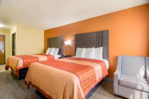 מיטה או מיטות בחדר ב-Americas Best Value Inn & Suites Independence VA