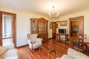a living room with a couch and a table at Plaza berri - baskeyrentals in Azpeitia