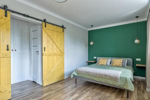Posteľ alebo postele v izbe v ubytovaní Apartament Wschodni