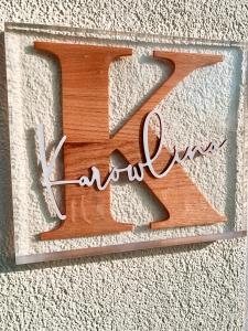a wooden letter z on the side of a wall at Karowlina Cozy House Berlin 1-4 Person in Berlin