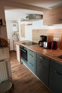 a kitchen with a sink and a stove top oven at Karowlina Cozy House Berlin 1-4 Person in Berlin