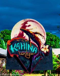 a sign for a gaming establishment with a dragon on it at Kahina Lodge in Hanga Roa